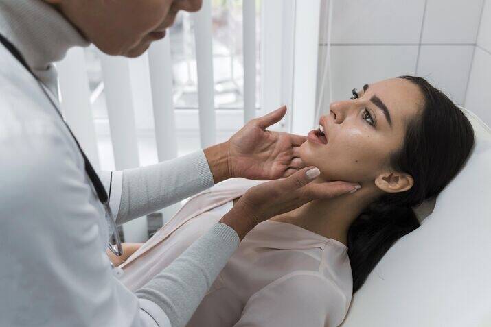 Dentist checking a patient
