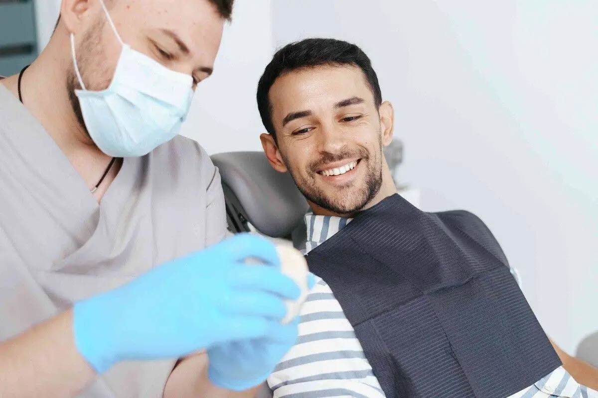 Orthodontist explaining palatal expander treatment for jaw development