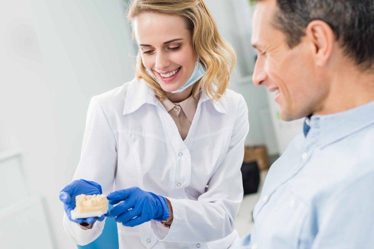 Orthodontic provider discussing jaw and bite treatment options with a patient