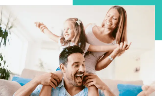 family smiles daughter on dads shoulders and mother holding her daughter hands